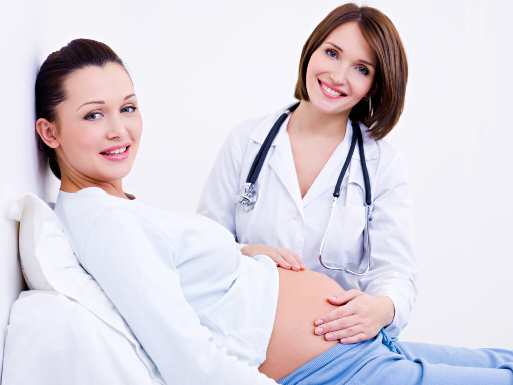 A female doctor examining a pregnant women