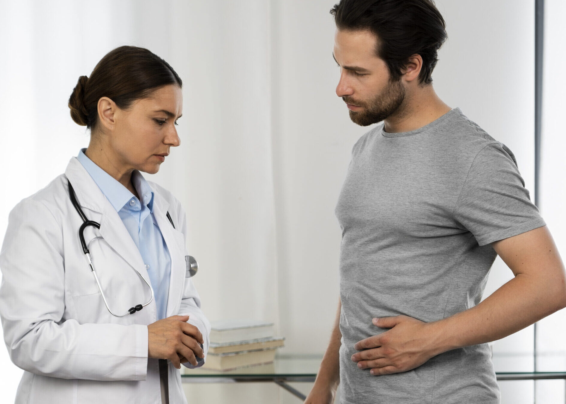 An image showing a doctor consulting a patient for gastroenterology.